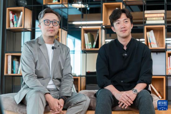 　　9月2日，林鴻勝（左）和黎偉杰接受采訪。 新華社記者 朱煒 攝